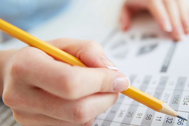 Close-up image of a financial worker analyzing statistical data