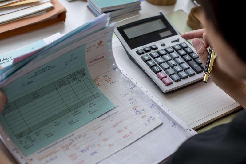 Adult asian woman working on payment bills accounting summary da Adult asian woman working on payment bills accounting summary data