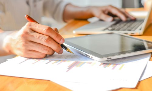 Business Analyst graph , Analysts graph in office , Performance Business Analyst graph , Analysts graph in office , Performance analysis chart.Blur images and poorlight background.